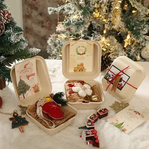 Pulp Christmas gift box with plush ornaments, golden bells and festive greeting cards