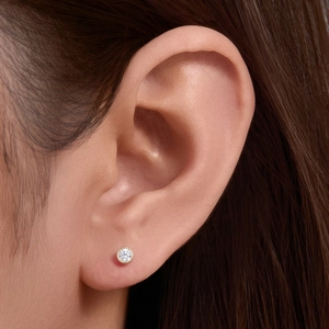 Elegant s925 silver bezel-set round diamond stud earrings in gold plating for women