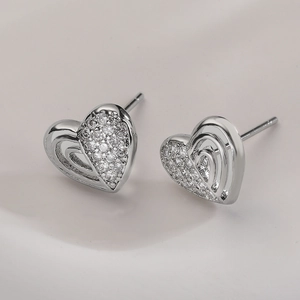 Minimalist silver heart stud earrings with cubic zirconia inlay for a polished finish