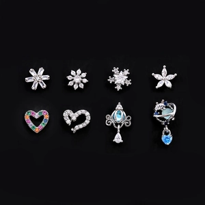 Detailed set of 8 silver stud earrings with zircon heart, star and crown designs