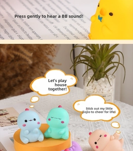 Close-up of colorful soft vinyl dinosaur squeeze toys with sound feature for kids