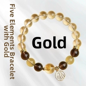 Detail of natural aventurine stone bracelet with gold Fu pendant on silk background