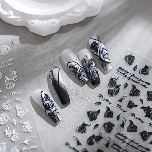 Minimalist black rose embossed nail art stickers with 3D floral designs and script text
