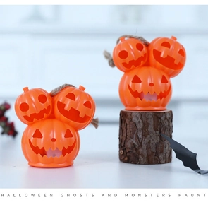 Three-stacked orange pumpkin lanterns with rustic hemp rope for Halloween decor