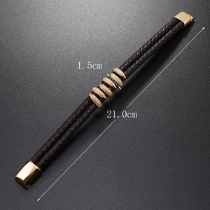 Detail of dark brown braided leather bracelet with golden magnetic clasp and 21cm sizing
