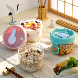 Portable breakfast yogurt cup set with spoon and lid in pink and teal pastel colors