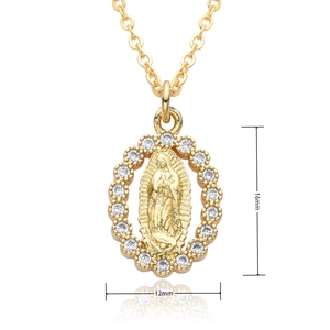 Detail shot of 16mm x 12mm Virgin Mary oval gold pendant with zircon halo and size labels