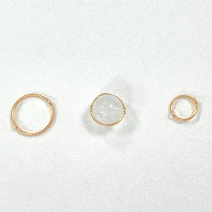 Three-piece gold S925 sterling silver jewelry ring set with a clear bead and textured band