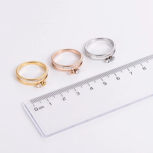 Three-color minimalist double-layer zircon rings with beads shown against a ruler for size