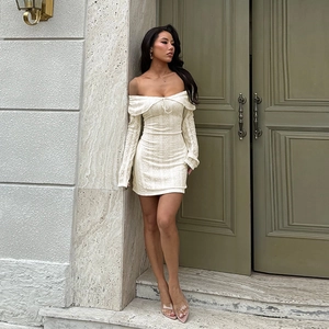 Detail of white lace off-shoulder long sleeve dress with lace-up neckline design