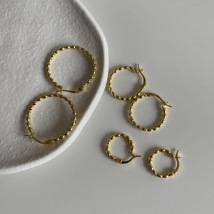 Three pairs of gold-plated S925 sterling silver hoop earrings with bead textures
