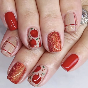 Short square red Christmas press-on nails with apple patterns and glitter finish