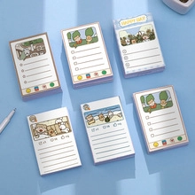 Flat lay of multiple colorful alpaca cartoon sticky note pads with writing sections