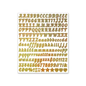 Detailed macro view of 0.5-inch gold glitter alphabet and numeric stickers on white background