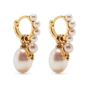 Close-up of golden hoop earrings with detachable white pearls and drop pendant detail