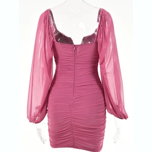 Detail of rose red backless dress with ruched texture and sheer mesh lantern sleeves