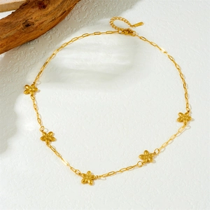 Polished gold-plated stainless steel chain necklace with star charms on white background