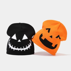 Halloween knitted beanies featuring pumpkin and skull patterns for winter warmth