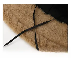 Detail of adjustable black silk drawstring and soft brown plush lining of the bucket hat