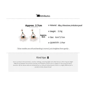 Detail view of pearl tassel earrings with 8cm length and 2.7cm width dimensions