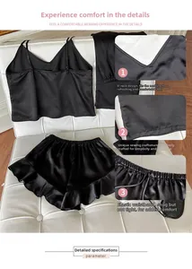 Detailed view of black satin sleepwear featuring V-neck lace top and elastic ruffle shorts