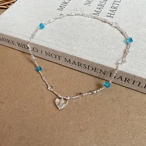 Beaded necklace with starfish starfish heart glass pendant and sky blue cubes design