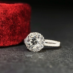 Macro shot of 925 sterling silver ring with 1ct moissanite and halo diamond setting