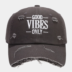 Detailed front view of charcoal grey washed cotton baseball cap with white embroidery