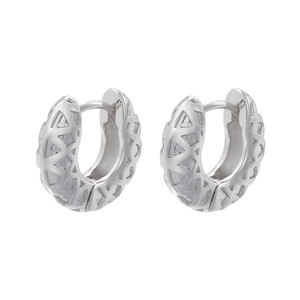 Close-up of silver hoop earrings with intricate geometric triangular hollow-out design
