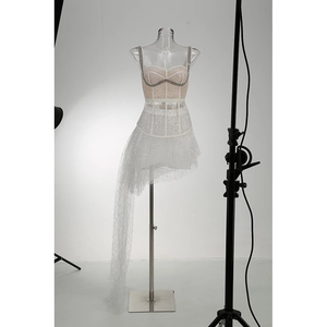 Detail of champagne rhinestone bodice and irregular mesh skirt on elegant dress