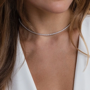 Elegant silver tennis necklace with pear and square shaped zircon stones in a fine setting