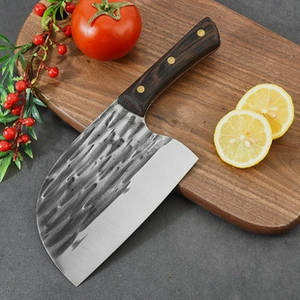 Detail of stainless steel apple slicer with hammer texture and dark wood handle