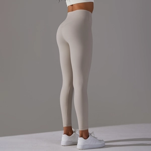 Detail of high waisted yoga leggings in light oatmeal grey with a seamless finish