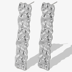 Detailed view of silver 304 stainless steel earrings with irregular pleated texture
