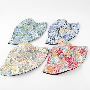 Floral cotton reversible bucket hats for women in four colorful patterns on white background