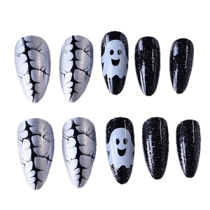 Halloween ghost stiletto press-on nails with black and white patterns and crackle design