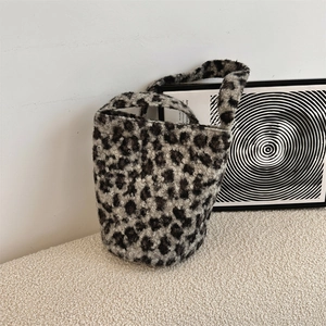 Close-up of leopard print faux fur bucket bag showing soft plush texture and pattern