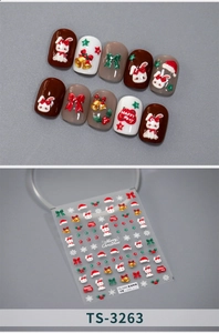 3D embossed Christmas nail stickers with rabbit, hat and bell motifs on grey background