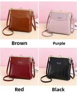 Detail view of vintage crocodile texture crossbody bags in brown, purple, red, and black