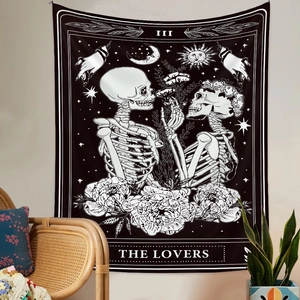 Detail of tarot lovers skull tapestry featuring monochrome art with sun and moon motifs