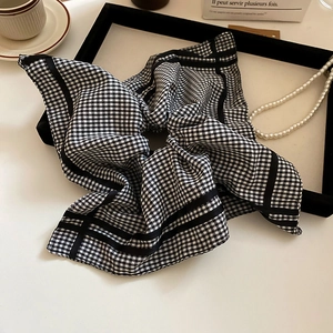 Detail of vintage black and white gingham hair scarf with French style aesthetic props