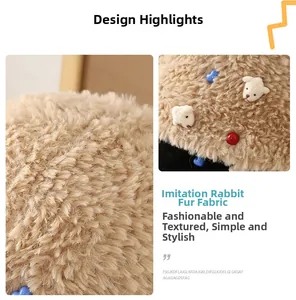 Detailed close-up of fuzzy faux rabbit fur bucket hat with cute bear and button accents
