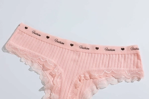 Close-up of pink cotton thong with ribbed texture, lace trim and Fashion logo waistband