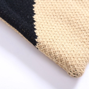 Knit tote bag with black and beige jacquard pattern showing detailed wool texture