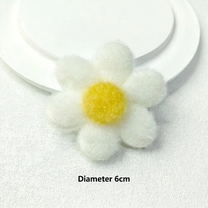 Detailed view of a 6cm plush flower accessory with white petals and yellow center