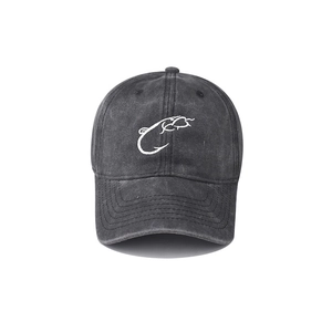 Close-up of embroidered fish hook logo on washed cotton baseball cap with 3D details
