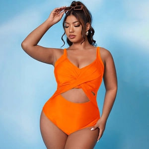 One-piece bright orange swimsuit with crossover wrap design and waist cut-out detail