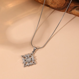 Detail of silver Celtic knot necklace with opal stone and small crystals on snake chain