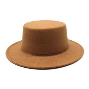 Detail shot of the flat top crown and texture of the brown wool felt boater hat