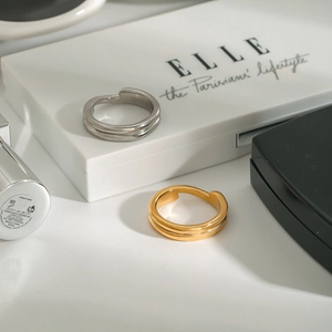 Minimalist double-layer 18K gold and silver stainless steel open rings in a lifestyle setting